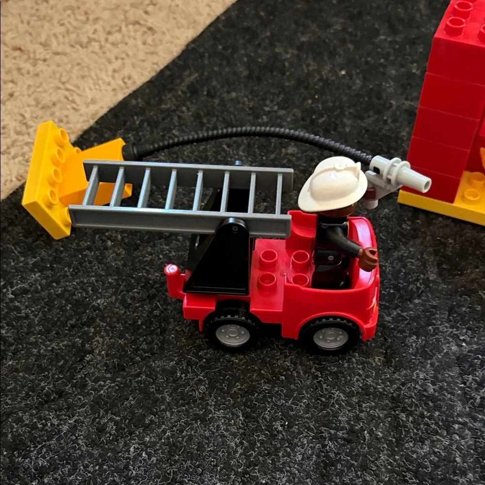 Lego Duplo Fire Truck With Firefighter Figure with fire hydrant and flame pieces